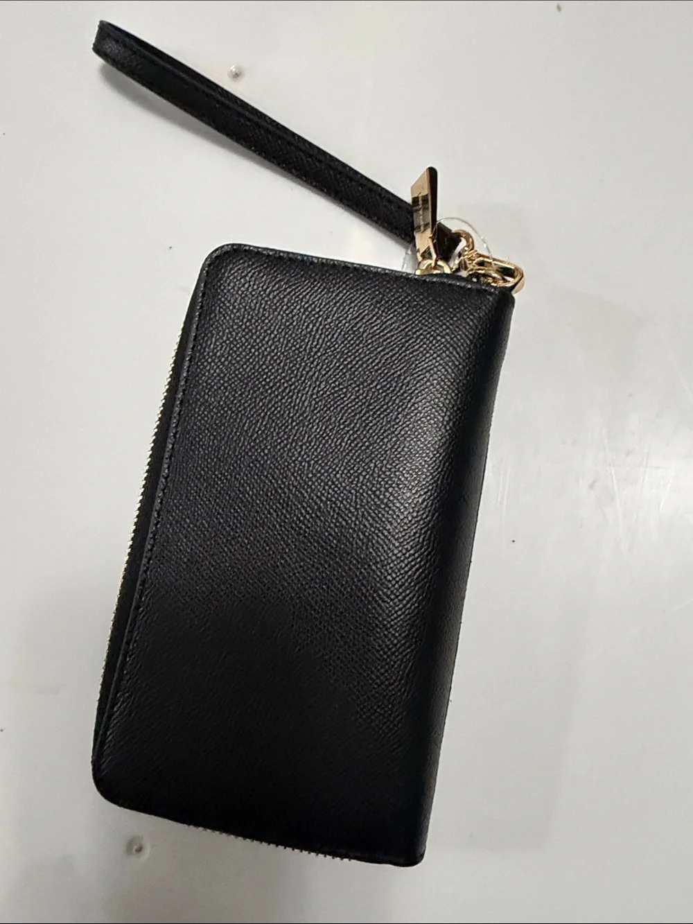 Michael Kors Black Wristlet with Gold Stud Pattern